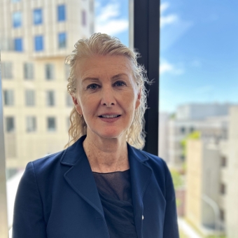 Celia Loneragan standing smiling at RHIP