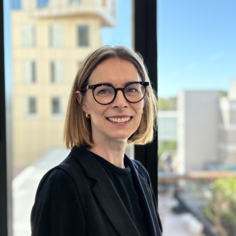 Natalie Walsh standing smiling at RHIP