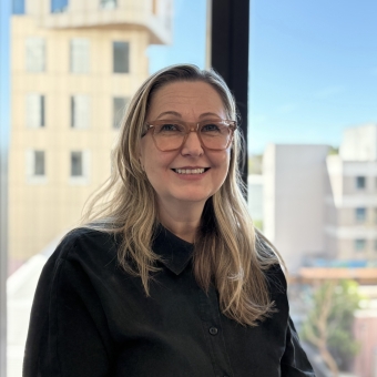 Sophie Forbat standing smiling at RHIP