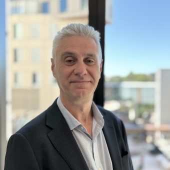 Dr Stephen Palmer standing smiling at RHIP