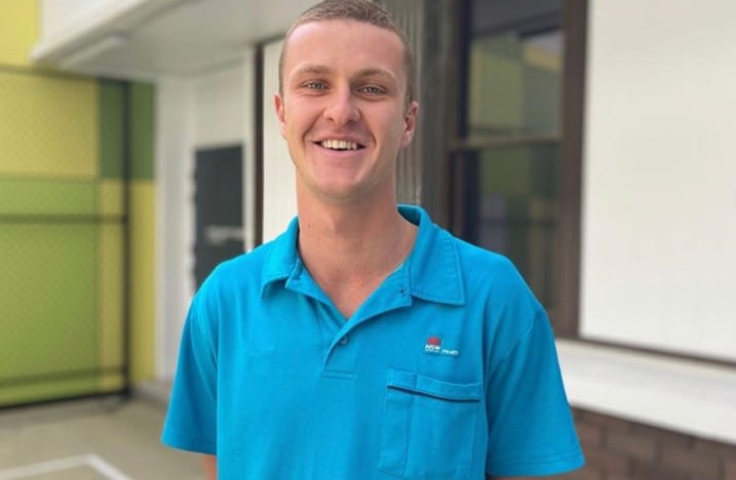 Jarrad Fisher standing smiling for a photo